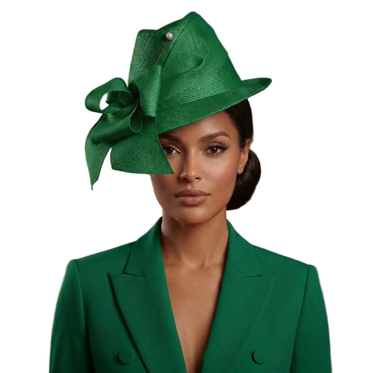 Woman wearing a green hat and coat with a neutral background