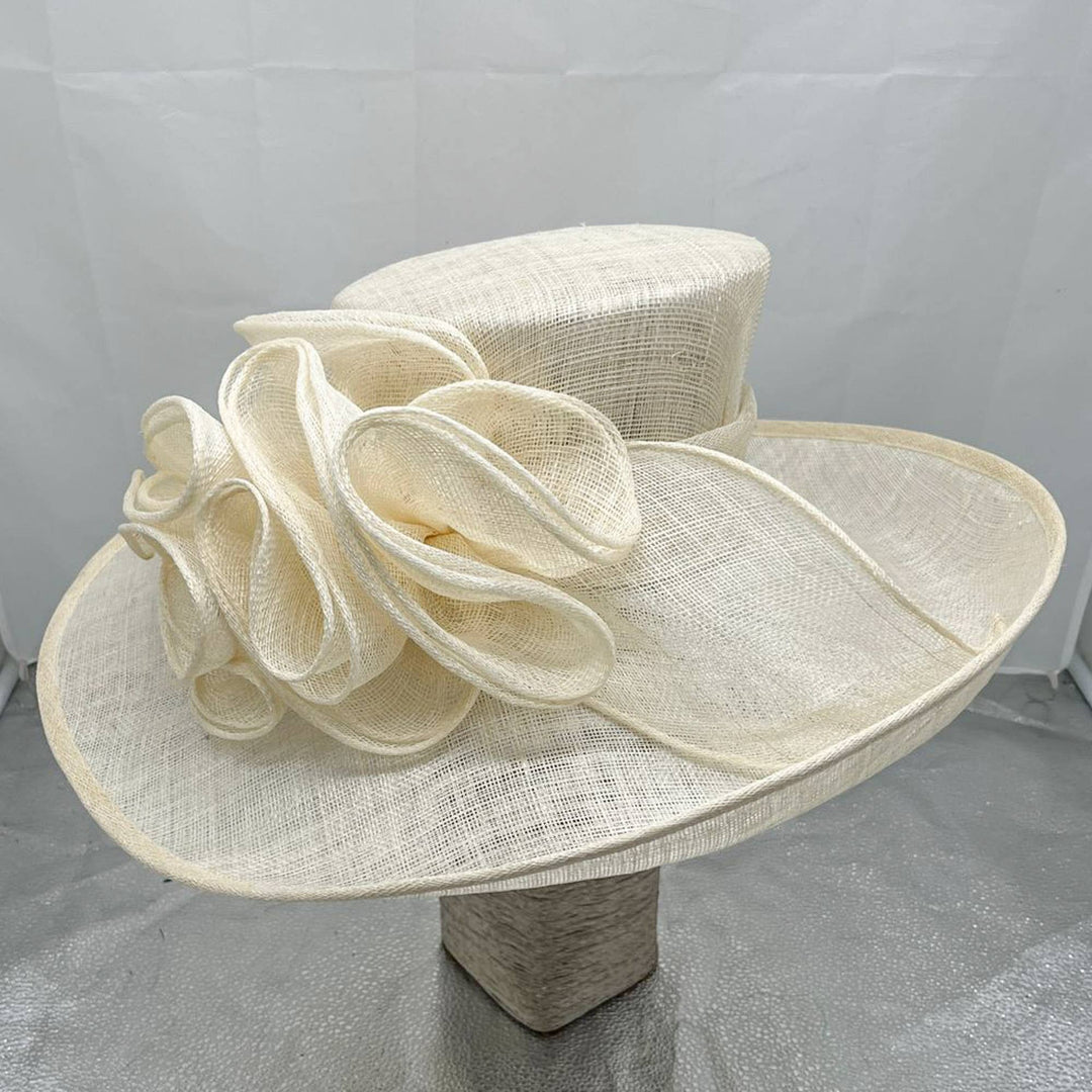 Madhatter style hat embellished with sinamay swirls: Lime