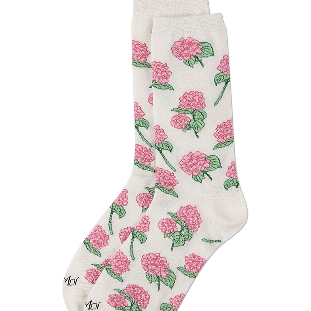 A pair of off-white crew socks with an all-over pink rose and green leaf pattern, displayed against a solid white background.
