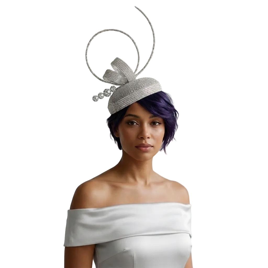 Woman wearing a silver headpiece with a bow against a gray background