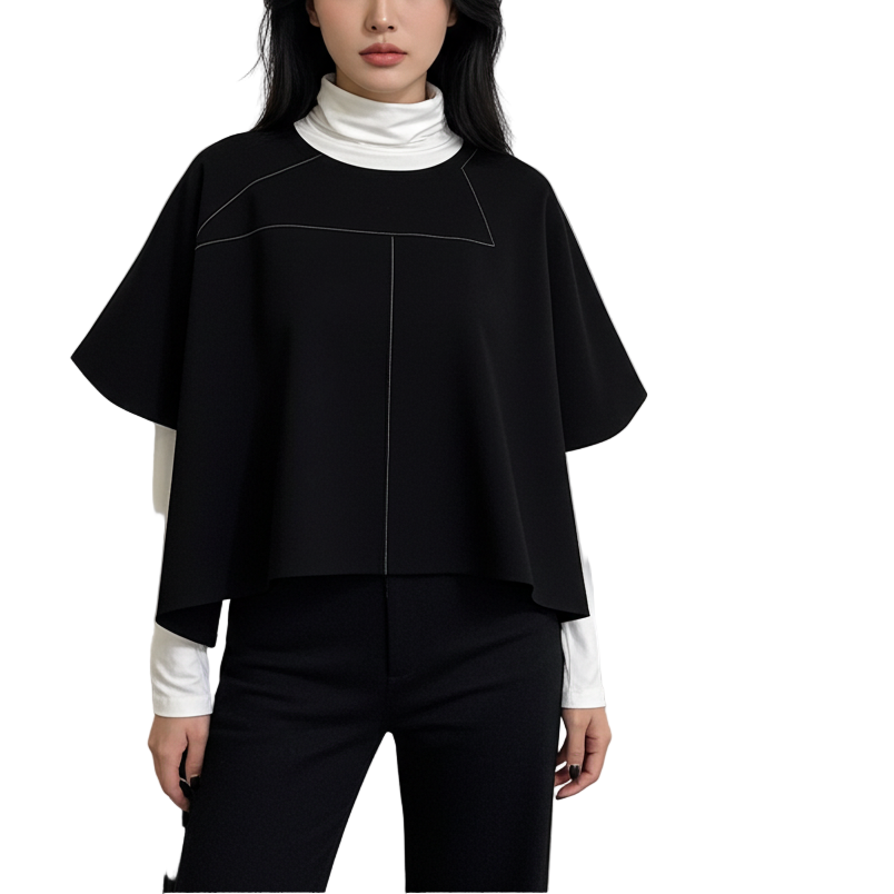 Woman in a black outfit standing in an art gallery with artworks on the walls.