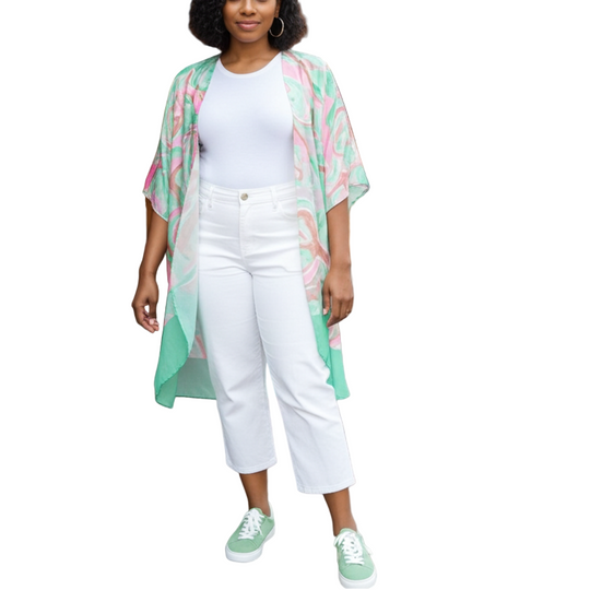 Woman in a colorful kimono standing on a sidewalk with a restaurant in the background