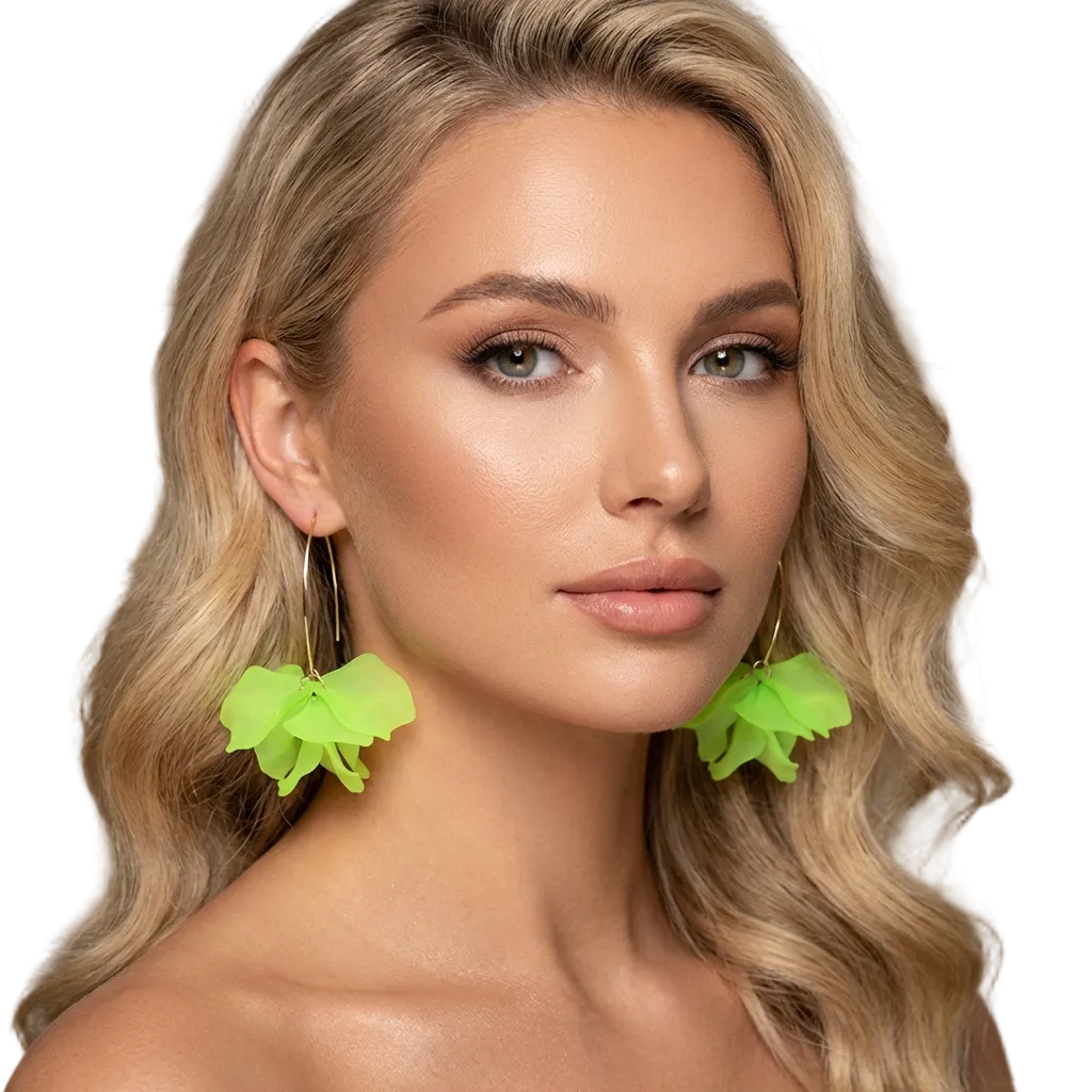 Woman wearing bright green floral earrings with a neutral background