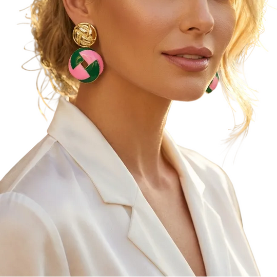 Woman wearing colorful earrings with a blurred outdoor background