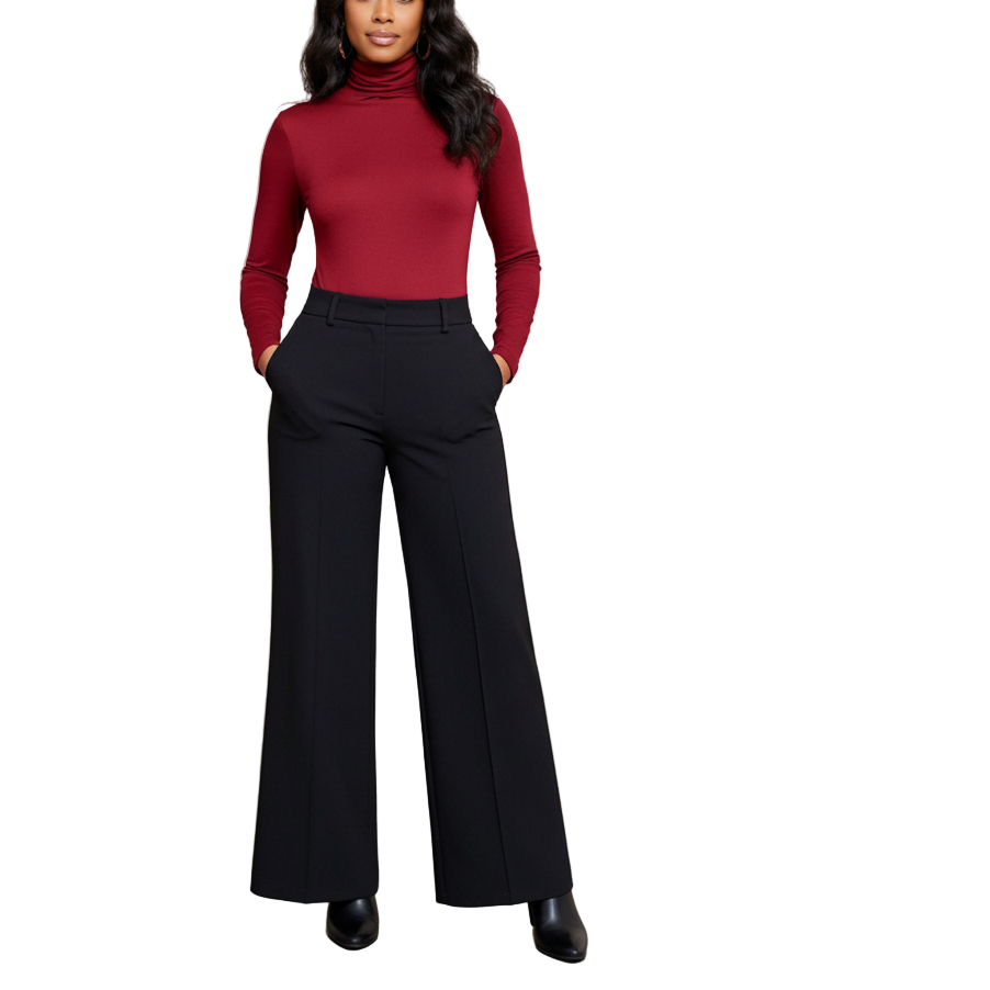 Woman in a red turtleneck and black pants standing in an art gallery.