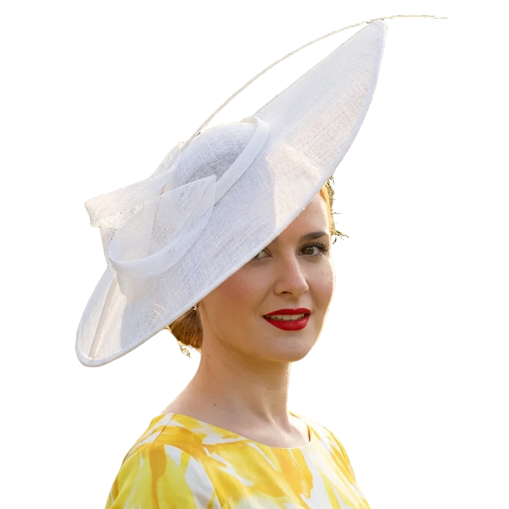 Woman wearing a large white hat in a garden setting
