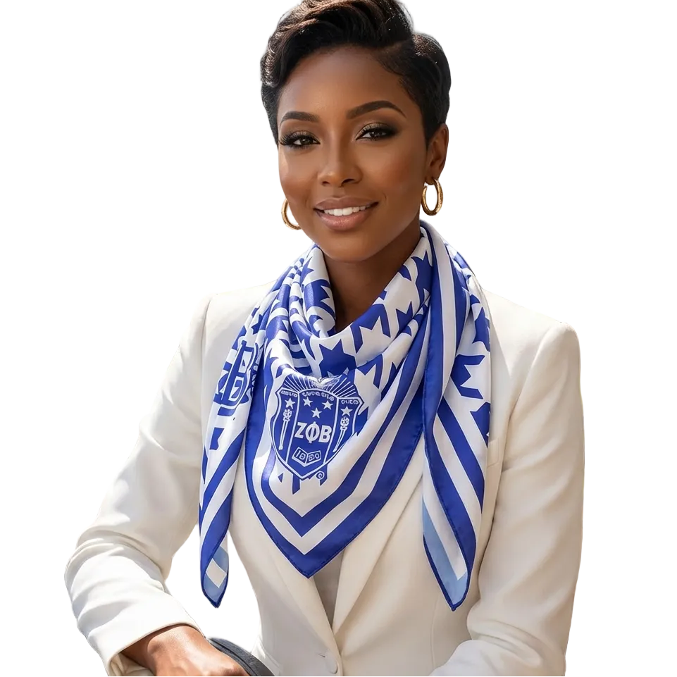 Woman wearing a blue and white scarf with a logo, sitting outdoors with a scenic background.