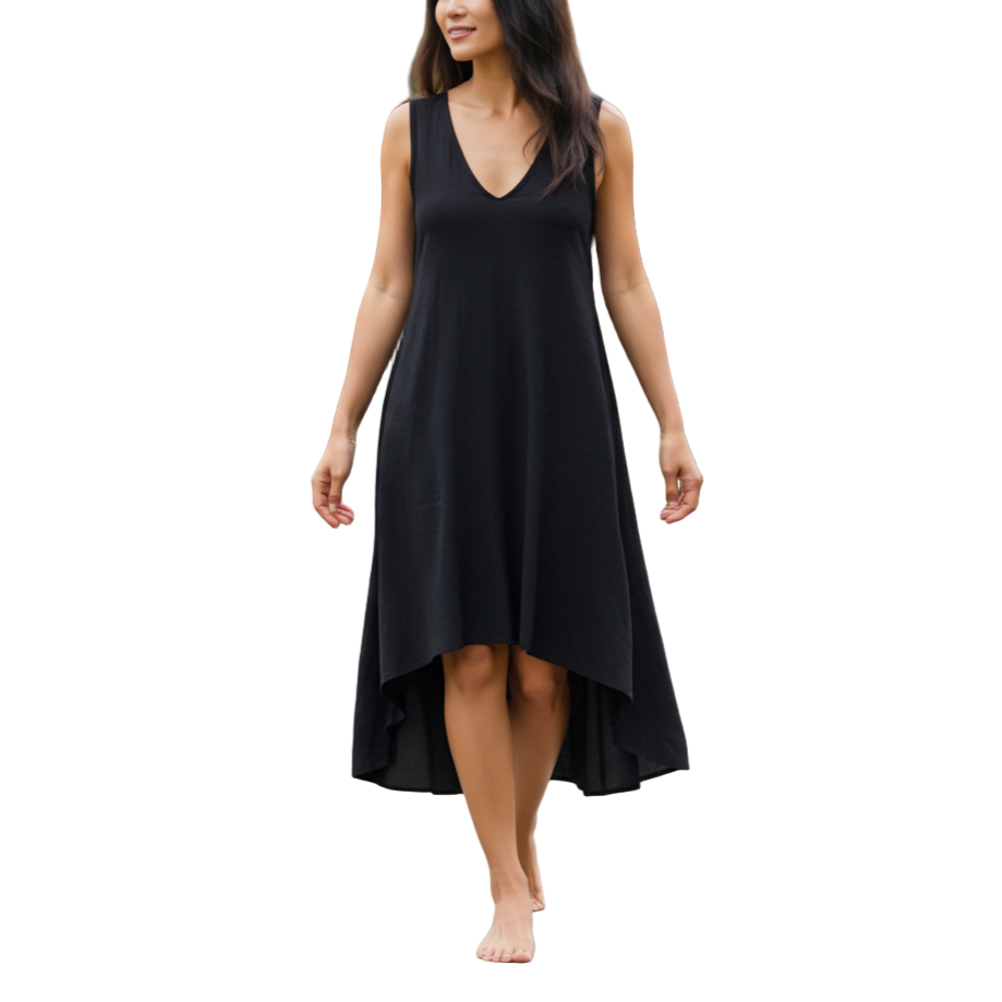 Woman in a black dress walking in a garden setting