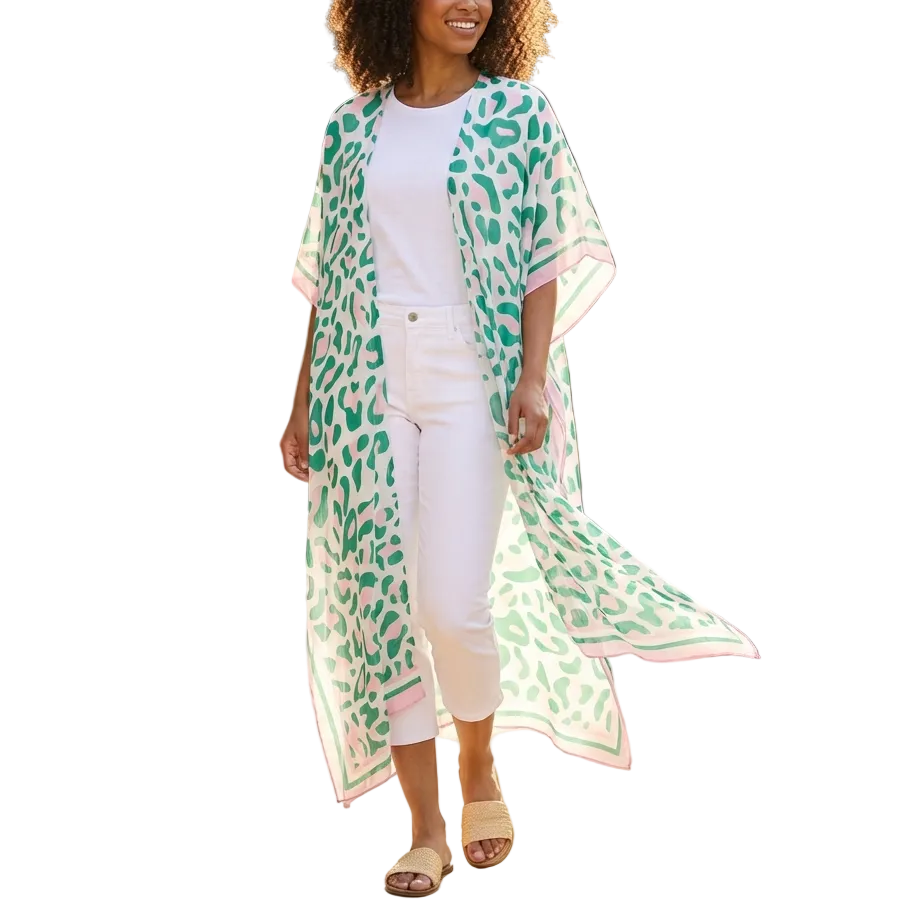 Woman wearing a green and white patterned kimono standing in a garden.