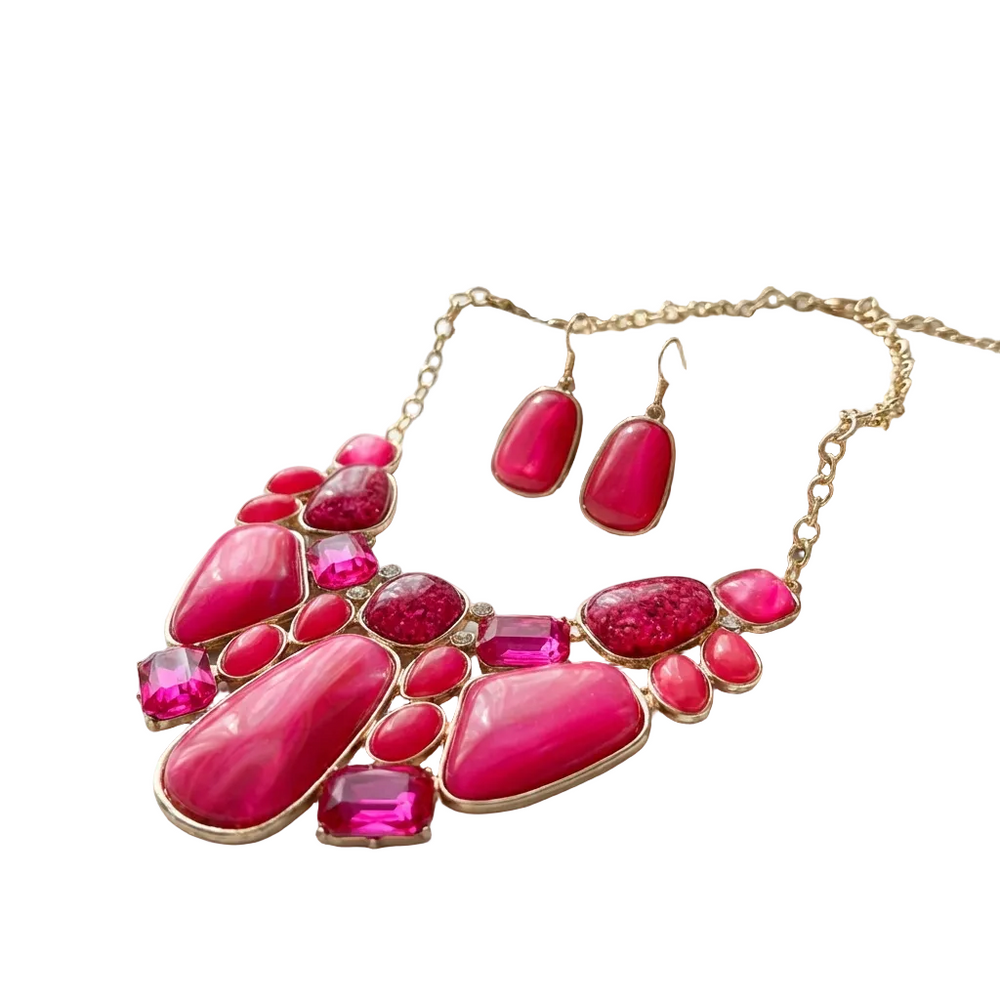 Necklace with pink gemstones on a marble surface