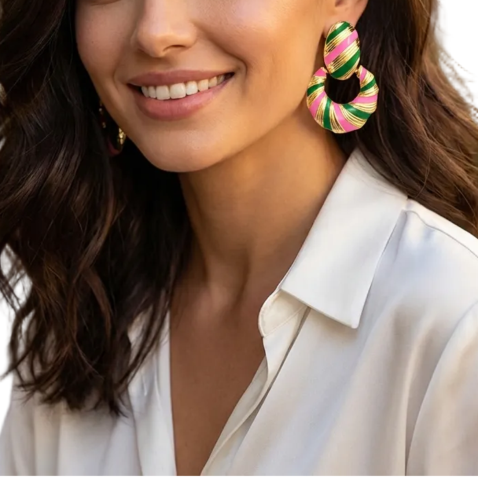 Woman wearing colorful earrings with a blurred outdoor background