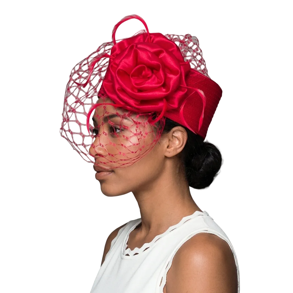Woman wearing a red rose fascinator on a gray background