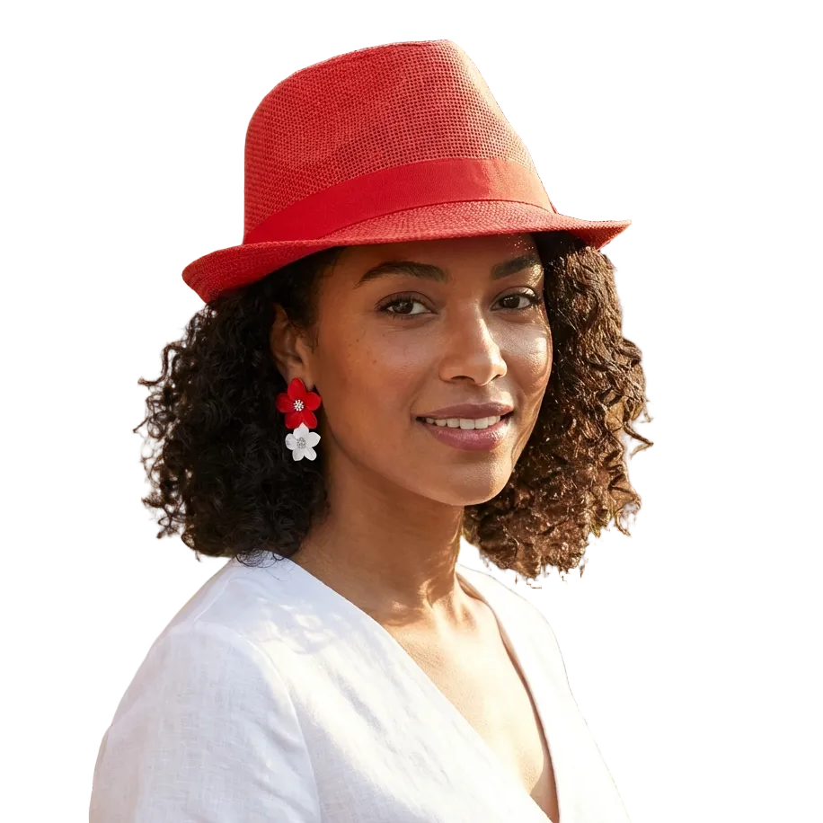 Woman wearing a red hat and white shirt outdoors