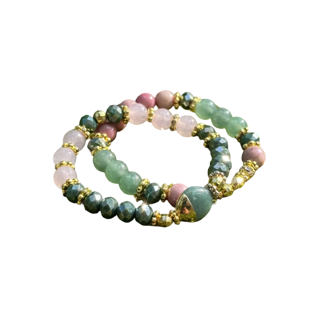 Multicolored beaded bracelet on a bed of green moss with a forest background