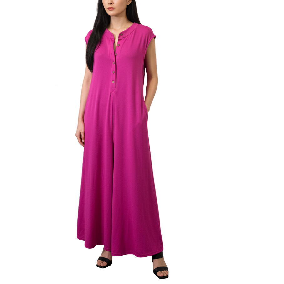 Woman in a pink dress being photographed in an art gallery.