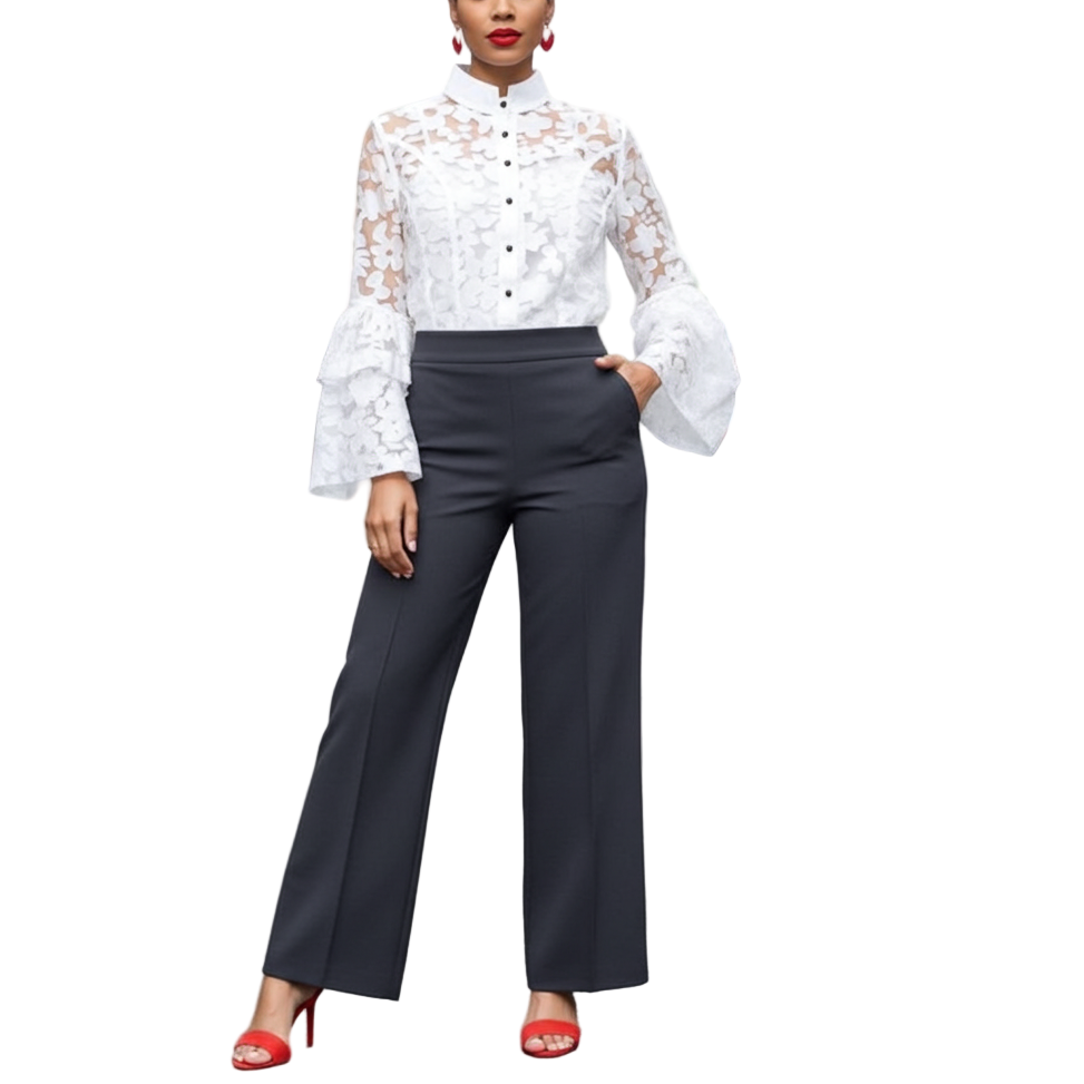 Woman in a white lace blouse and black pants standing on a city street.