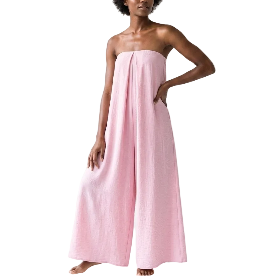 Woman wearing a pink strapless dress on a white background