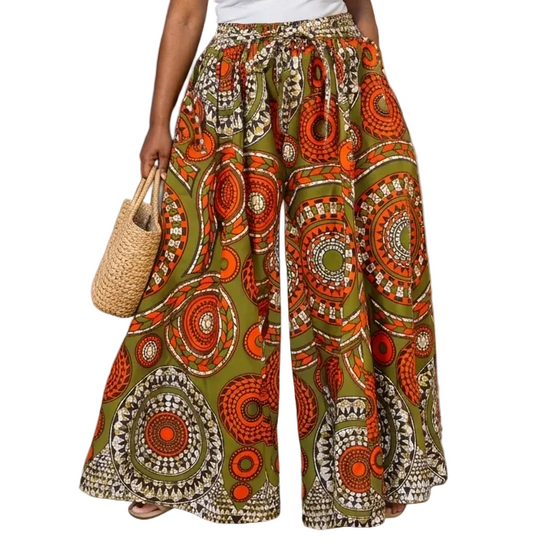 Woman in a colorful skirt standing on a street with shops and palm trees in the background