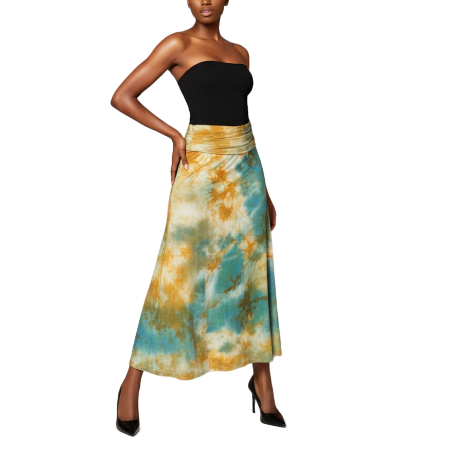 Woman in a colorful skirt standing in front of a vibrant, abstract wall mural.