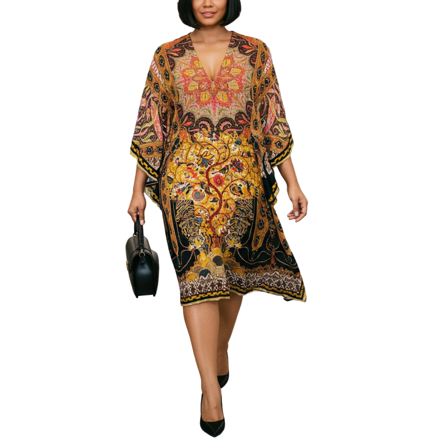 Woman in a patterned dress walking through an airport terminal.