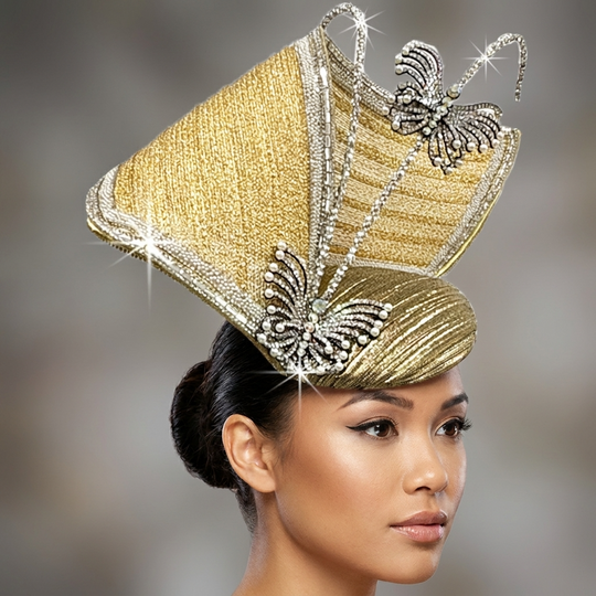 Woman wearing a gold and silver decorative headpiece with butterfly details on a blurred background