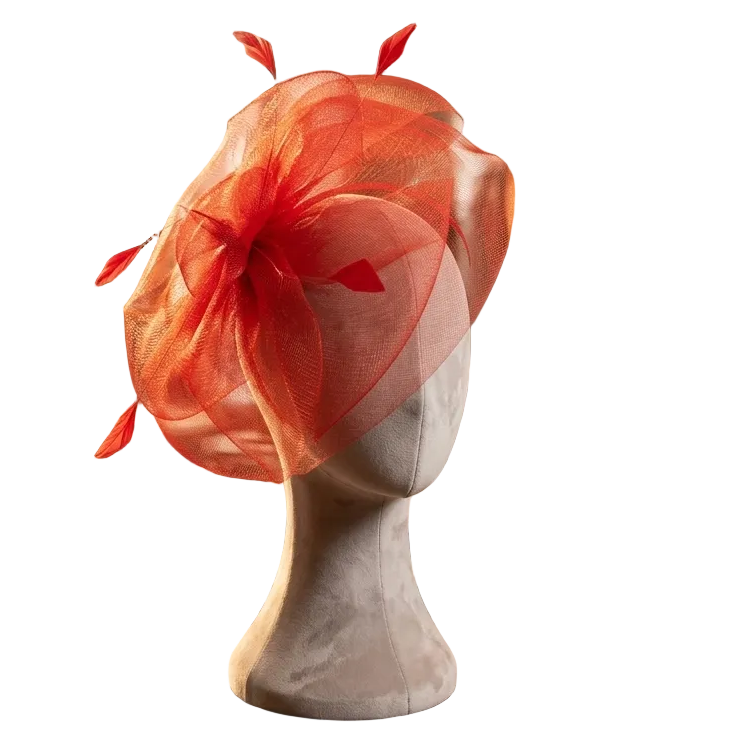Orange feathered hat on a mannequin head in a store setting with jewelry and clothing.