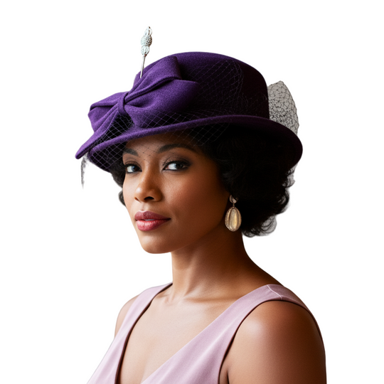 Woman wearing a purple hat with a decorative bow and feather against a neutral background
