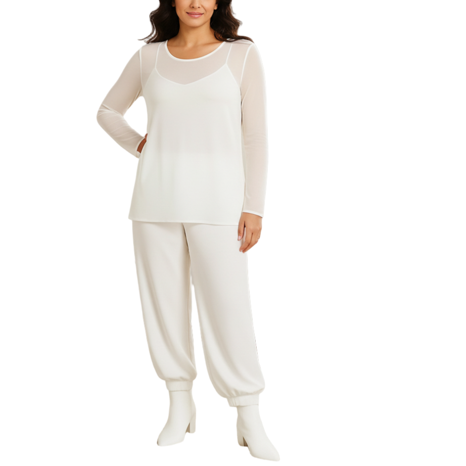 Woman wearing a white pajama set on a white background