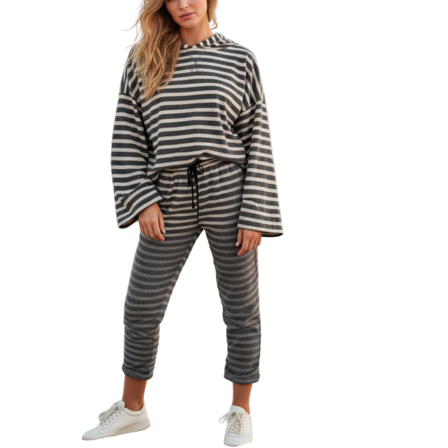 Woman wearing a striped outfit on a beach