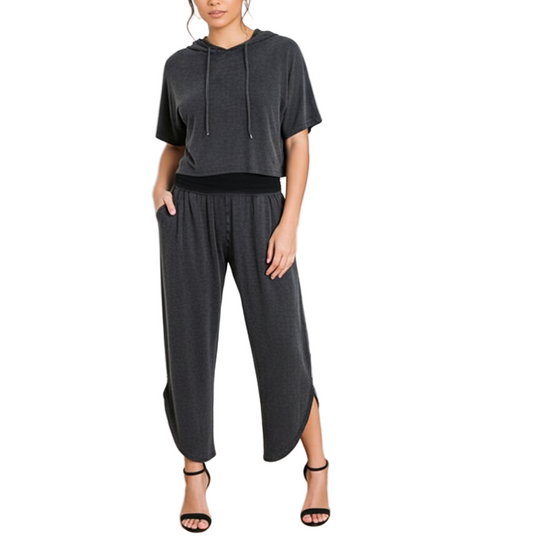 Model wearing charcoal gray tulip palazzo pants and crop hoodie lounge set with wide-leg tulip hem and pleated waistband.