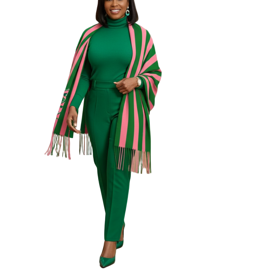 Woman in a green outfit with pink accents walking through an art gallery.