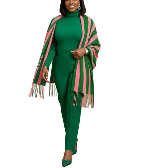 Woman in a green outfit with pink accents walking through an art gallery.