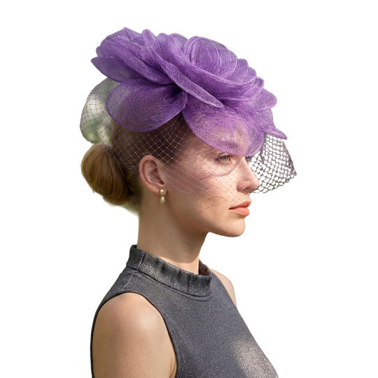 Woman wearing a purple floral hat in a garden setting