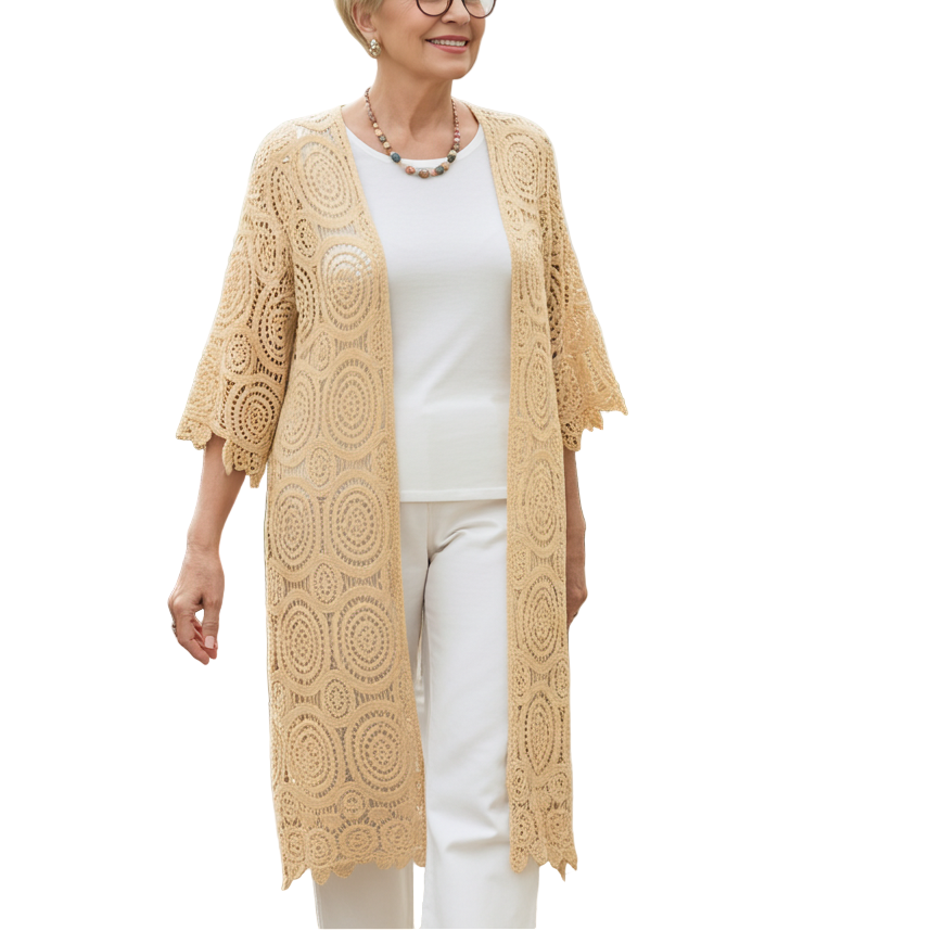 Woman wearing a beige lace cardigan in a greenhouse setting