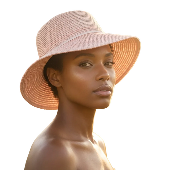 Woman wearing a wide-brimmed straw hat on a white background