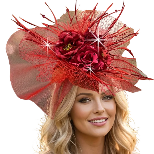 Woman wearing a red decorative hat with flowers and feathers outdoors.