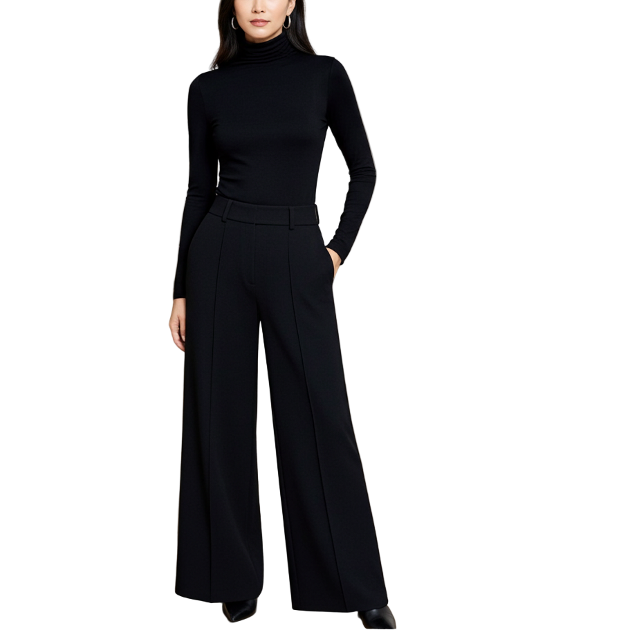 Woman in a black outfit standing in an art gallery.