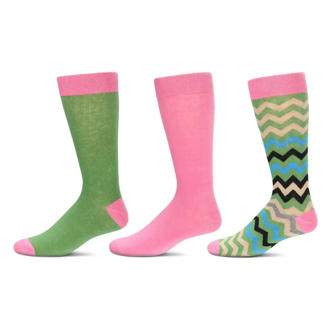 Three pairs of crew socks displayed side by side on a plain white background. The left pair is green with a pink cuff, heel, and toe.