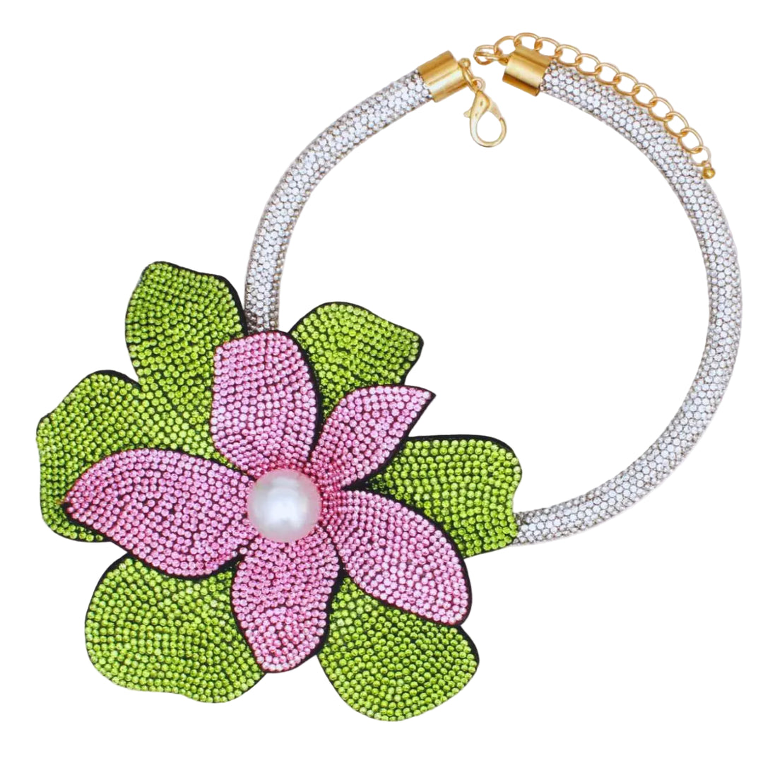 Necklace with pink flower and green leaves pendant on a white background