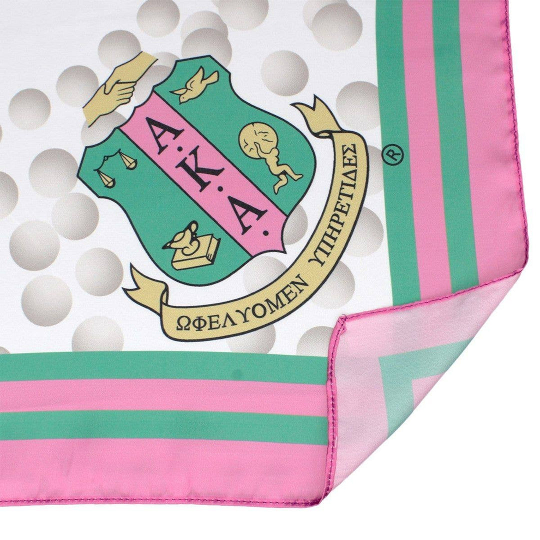 Pink and green scarf with Alpha Kappa Alpha sorority emblem on a white background