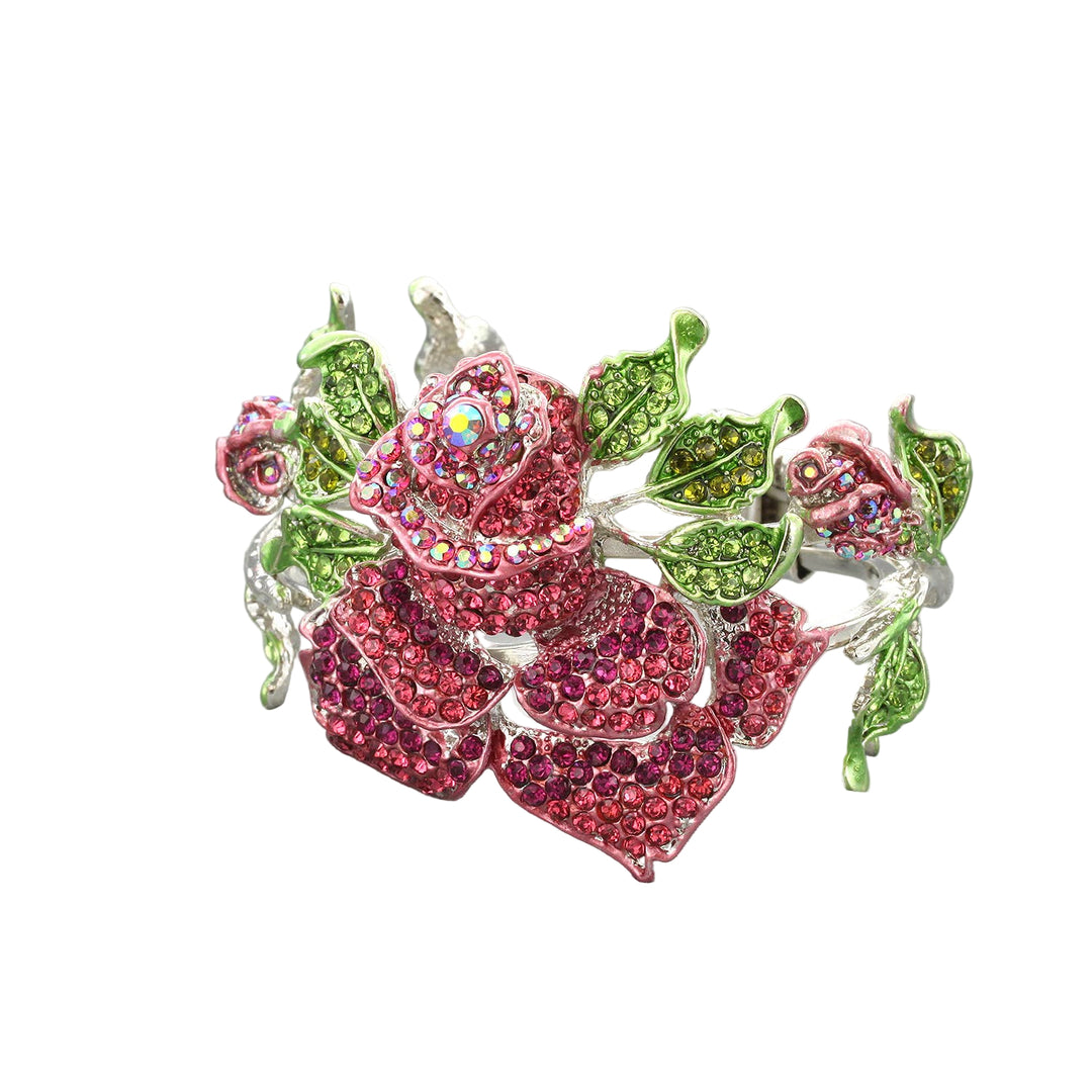 An oversized hinge bracelet with a rose motif, encrusted with sparkling rhinestone pavé in red and green colors, finished with a silver tone.