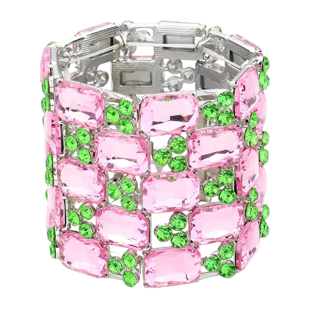 Bracelet with pink and green gemstones on a white background