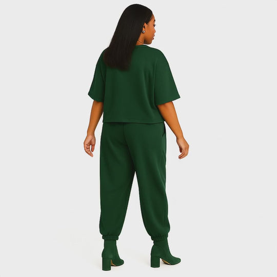 side view emerald green two piece outfit on model - video