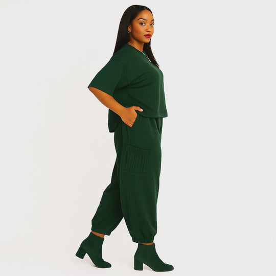 side view emerald green two piece outfit on model - video