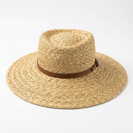Straw hat with a brown band on a white background
