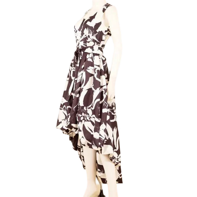 Mannequin wearing a black and white patterned dress on a beige background