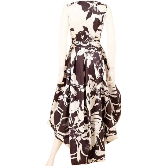 Mannequin wearing a black and white floral dress on a beige background