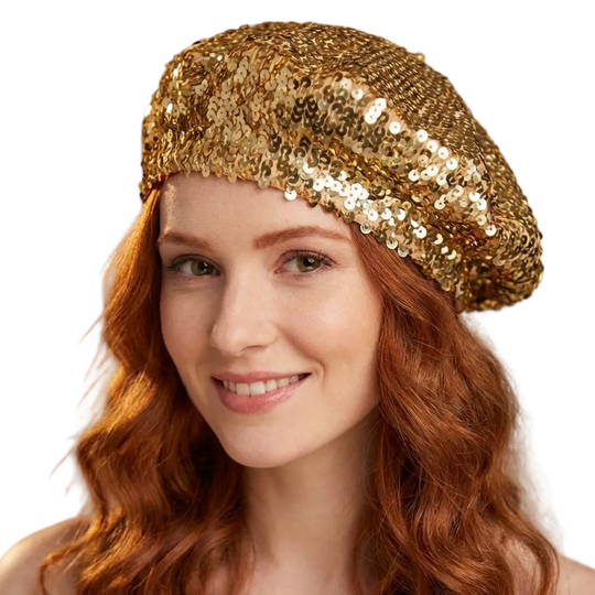Woman wearing a gold sequin beret against a blurred background