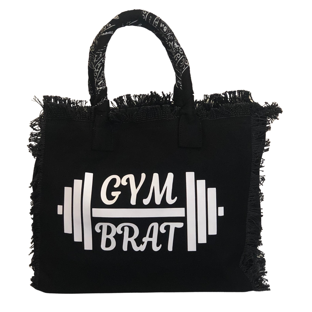Gym Brat Shoulder Tote - Bandana - Black
We have improved this best-selling bag! Now larger and roomier it's a shoulder tote and fully lined too! Fringe Bag Perfect everyday bag! - "Gym Brat" Fully lined canvas tote with soft-support bottom and bandana covered handles. Inside bag has 1 convenient inside zippered pockets and 2 insert pockets. Bag handles are at 7.5" drop and fits comfortably around the shoulder. Dimensions: 12"X14"X6.5" Made in USA
Gym Brat Shoulder Tote - Bandana - Black
Gym Brat, fully lin