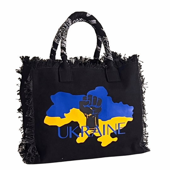 FUNDRAISER - Ukraine Shoulder Tote - Black
UKRAINE FUNDRAISER TOTE This expressive tote was designed as part of the Sandi_J Strength & Unity Tote Collection. The unique design signifies standing in solidarity with our Ukrainian sisters and brothers. 50% of proceeds will be donated to SIFH Global (501c3) for the purchase and delivery of diesel generators to Ukraine Fully lined canvas tote with soft-support bottom and bandana covered handles. Inside bag has 1 convenient inside zippered pockets and 2 insert po